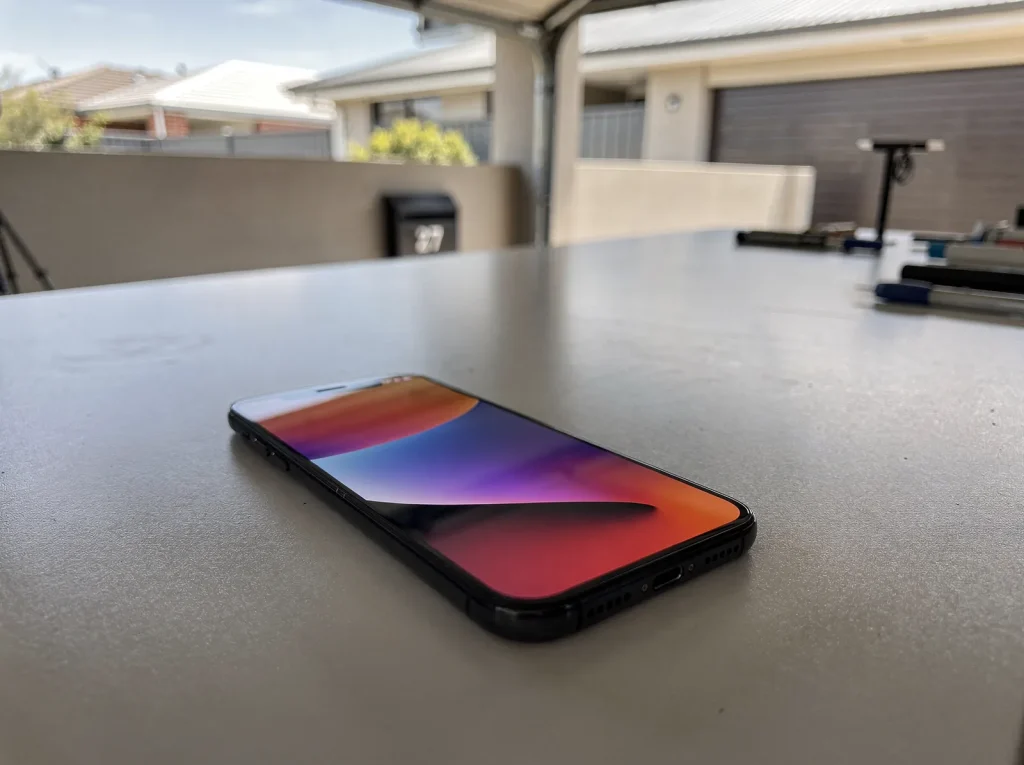 Repaired smartphone with pristine crack-free OLED display after West Perth phone repair.